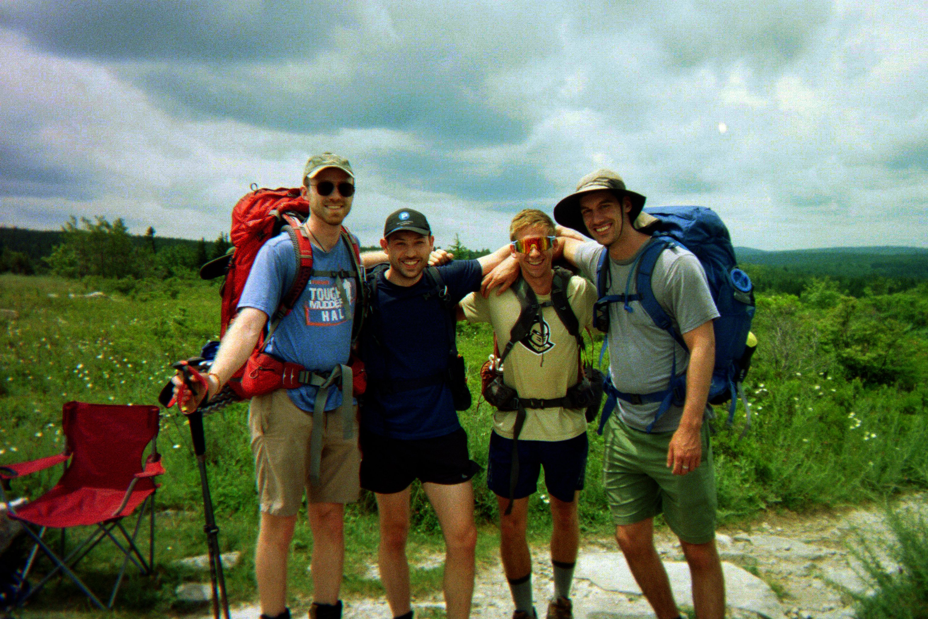 The writer and four friends ready to embark on their hike, all smiles